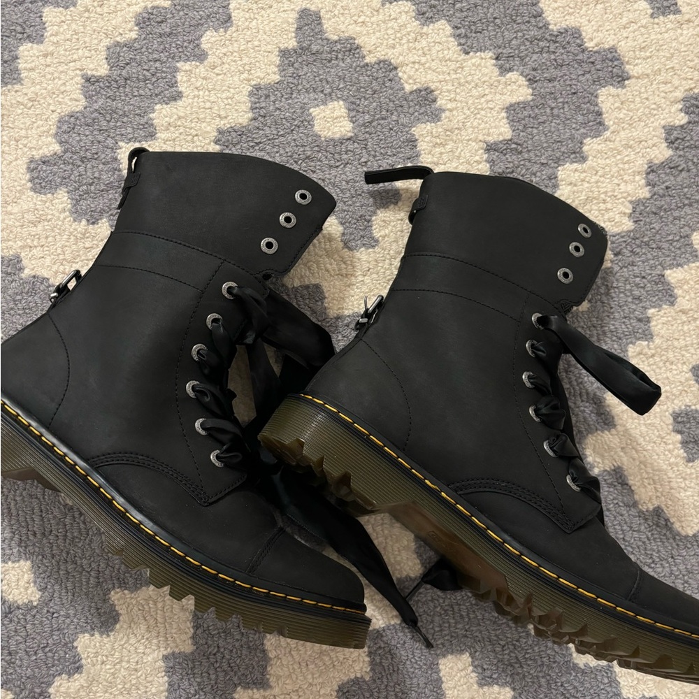 Doc Marten’s Boot with ribbon laces.  Combat boots with feminine style.